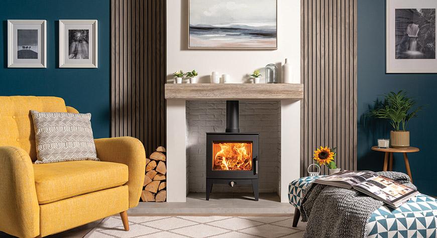 Stovax Futura 5 Wood burning stove, Longer Leg model, shown with ceramic wood effect beam