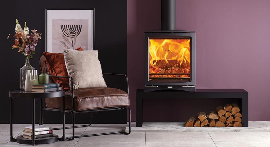Stovax Vogue Medium wood burning stove, shown on a 120 High Bench
